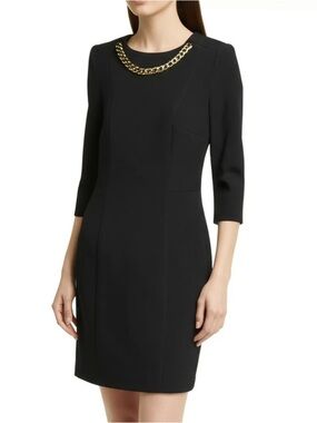 🎀 Perfect holiday mini dress with gold chain detail